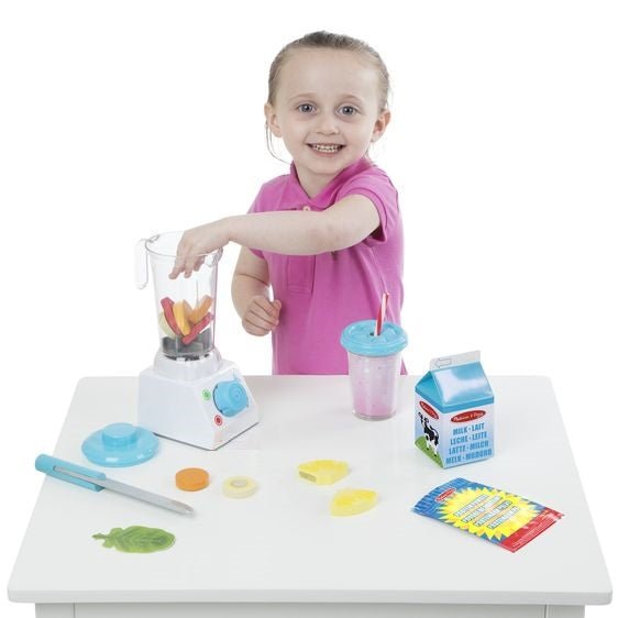 Little girl making pretend smoothie with Melissa & Doug blender set.
