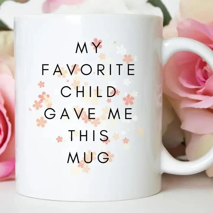 white mug with "My Favorite child gave me this mug" on front.
