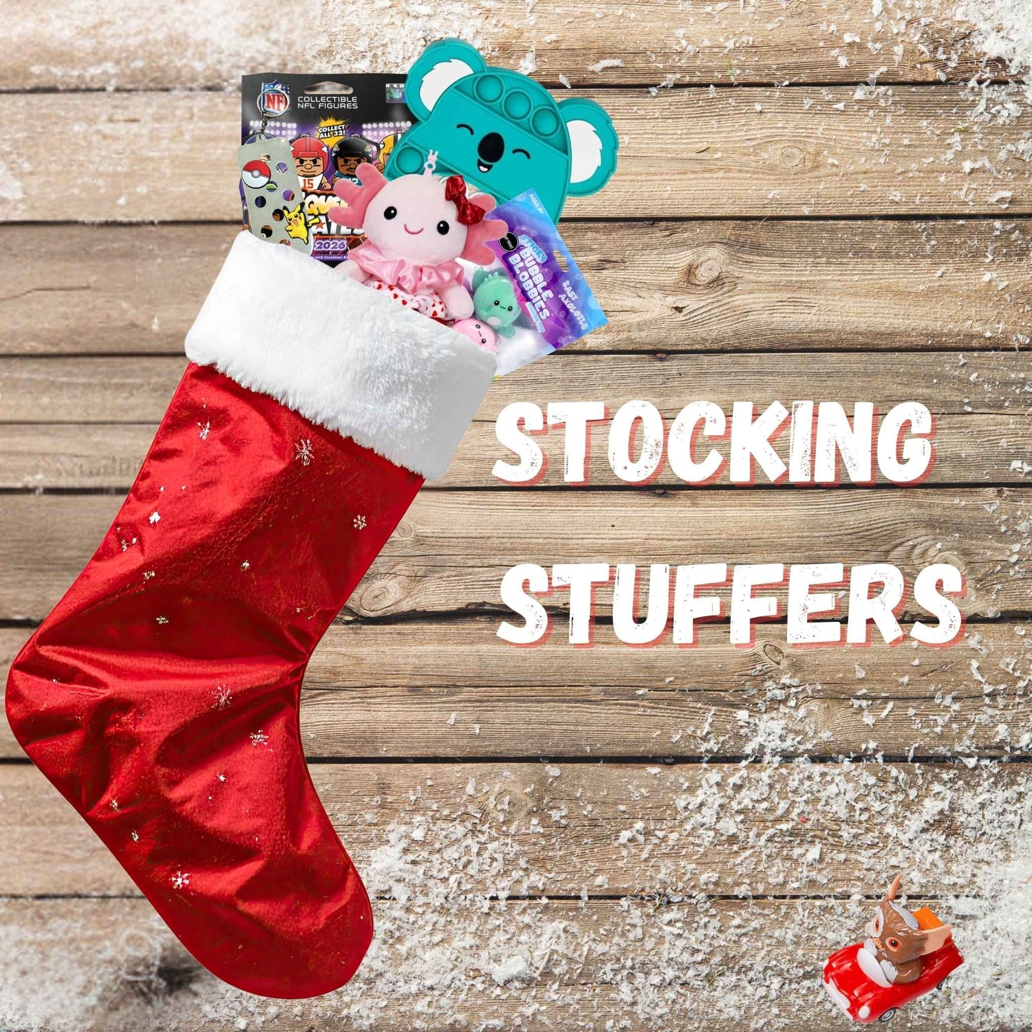 christmas stocking with toys inside on a wood background with snow.