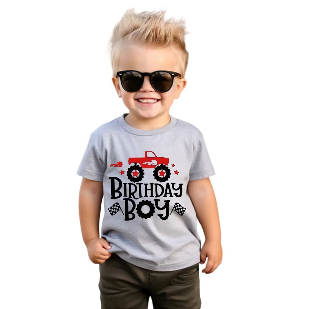 little boy in gray Birthday Boy Monster Truck Tshirt on a white background