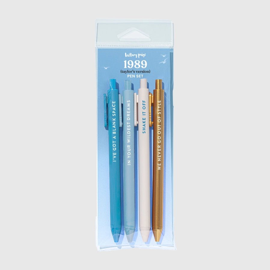 1989 4 pack pen set in blue, white, and gold with black ink in a package on light gray background. 