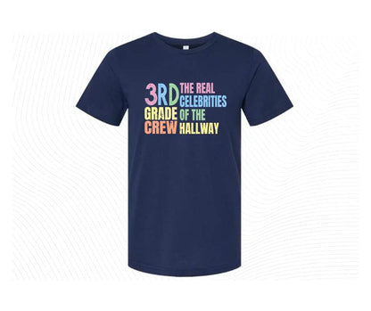Navy tshirt with colorful digital image with text "3rd grade crew. The Real celebrities of the hallway" on front.