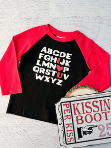 ABC I LOVE YOU Boy's Top. Black red sleeve raglan tee. Baby , Toddler, and kids sizes.  Alphabet on front with red I heart U letters on front.  Little Gift Nook.