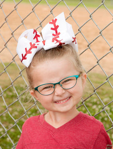 Baseball Texas Size Hair Bow. Red glitter "stitches" on white grosgrain ribbon bow.  Alligator clip at back.  Little Gift Nook.