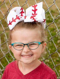 Baseball Texas Size Hair Bow. Red glitter "stitches" on white grosgrain ribbon bow.  Alligator clip at back.  Little Gift Nook.