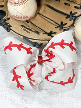 Load image into Gallery viewer, Baseball Texas Size Hair Bow. Red glitter &quot;stitches&quot; on white grosgrain ribbon bow.  Alligator clip at back.  Little Gift Nook.