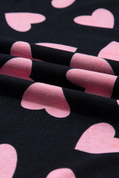 Black Pink Heart Shorts Pajamas set. Black long sleeve top with cuffs and pink heart print all over.  Close up of hearts. Black soft shorts, elastic waist, same heart print. Little Gift Nook.