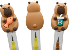 Load image into Gallery viewer, Capybara Non Sharpen Pencil. Stackable led tips inside. Capybara silicone topper.  Choose from Capybara holding boba tea or little fish. Little Gift Nook. 