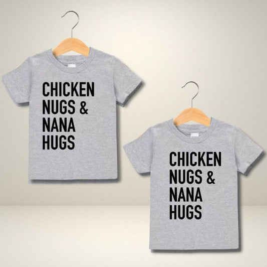 Chicken Nugs & Mimi or Nana Hugs T-shirt. Gray short sleeve poly cotton tshirts with black lettering on front. Choose from mimi hugs or nana hugs. - Little Gift Nook.