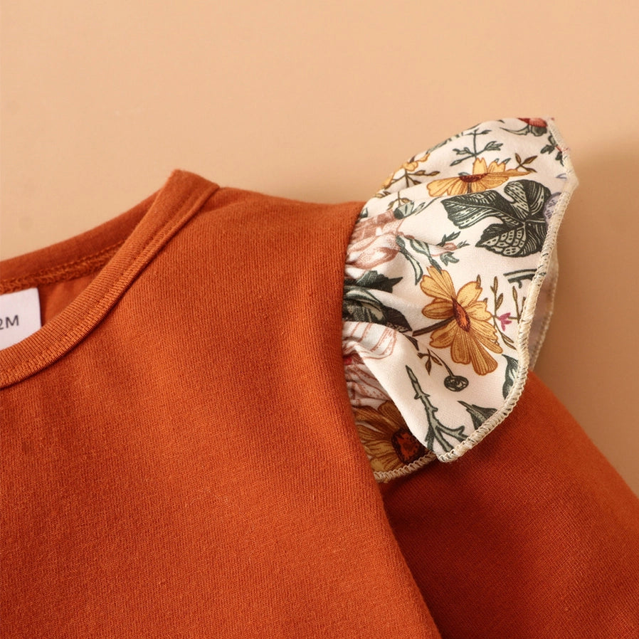 Close up of baby Floral Baby Girl dress set top with ruffle floral lettuce edge shoulder sleeve. Little Gift Nook.