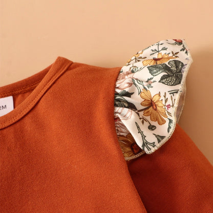 Close up of baby Floral Baby Girl dress set top with ruffle floral lettuce edge shoulder sleeve. Little Gift Nook.
