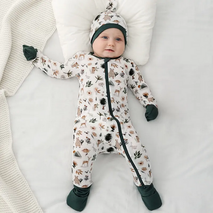 Forest Friends Bamboo Sleeper with fold over feet & hands. Cream & forest green fold over hands & feet. Sleeper shown on model with matching hat. Double zipper. Soft & Stretchy. Little Gift Nook.