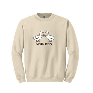 Goose Bumps Oatmeal Adult Crewneck Sweatshirts. Has 2 white geese on front fist bumping and the words Goose Bumps underneath. 