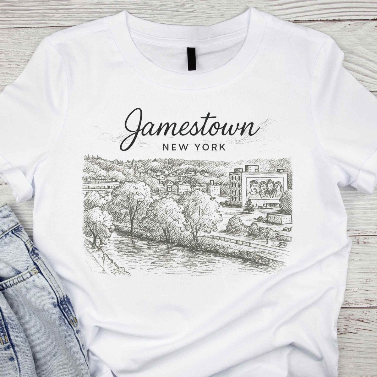 Jamestown NY City Sketch T-Shirt - Cityscape & Lucy Mural - white cotton short sleeve tshirt with brown sepia sketch of Jamestown NY city and Jamestown NY written across top - Little Gift Nook