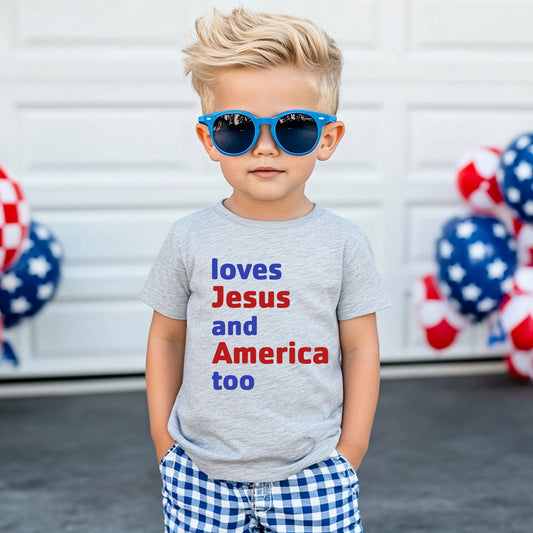 little toddler boy wearing heather gray tshirt with red and blue "loves Jesus and America too" lettering on front - Little Gift Nook