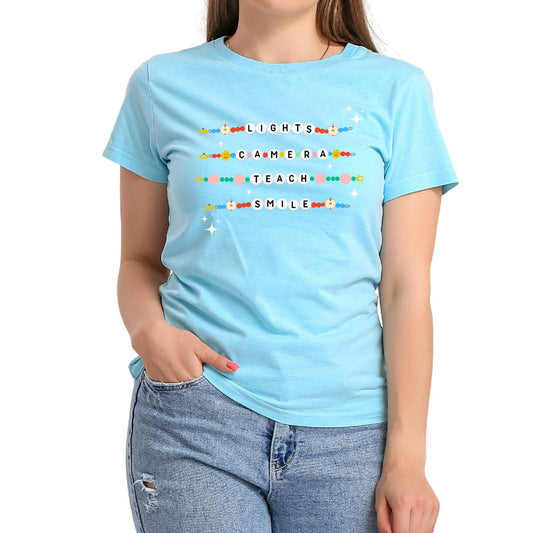 Light blue unisex tshirt with friendship bracelets and Lights, Camera, Teach, Smile in letter beads on front teacher  Tshirt - Little Gift Nook