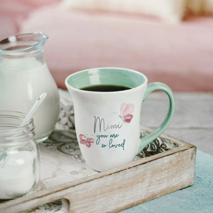 Mimi you are loved 16oz Mug. Pink butterflies on front and message with mint green interior and handle. - Little Gift Nook