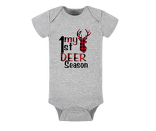 Load image into Gallery viewer, My 1st Hunting Season Baby Toddler Tshirt. Heather gray short sleeved onesie with red black buffalo plaid my 1st deer season lettering and plaid buck.  Little Gift Nook. 