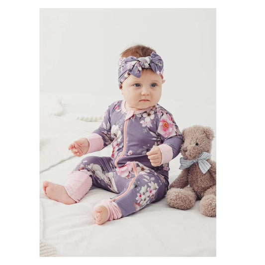 baby girl sitting up in Purple Floral Bamboo Baby Sleeper - lavender pink and white floral print sleeper - Little Gift Nook