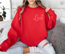 Load image into Gallery viewer, Red Pink LOVE Crewneck Sweatshirt. Red fleece lined unisex crewneck sweatshirt with pink LOVE and hearts at top left. Little Gift Nook.