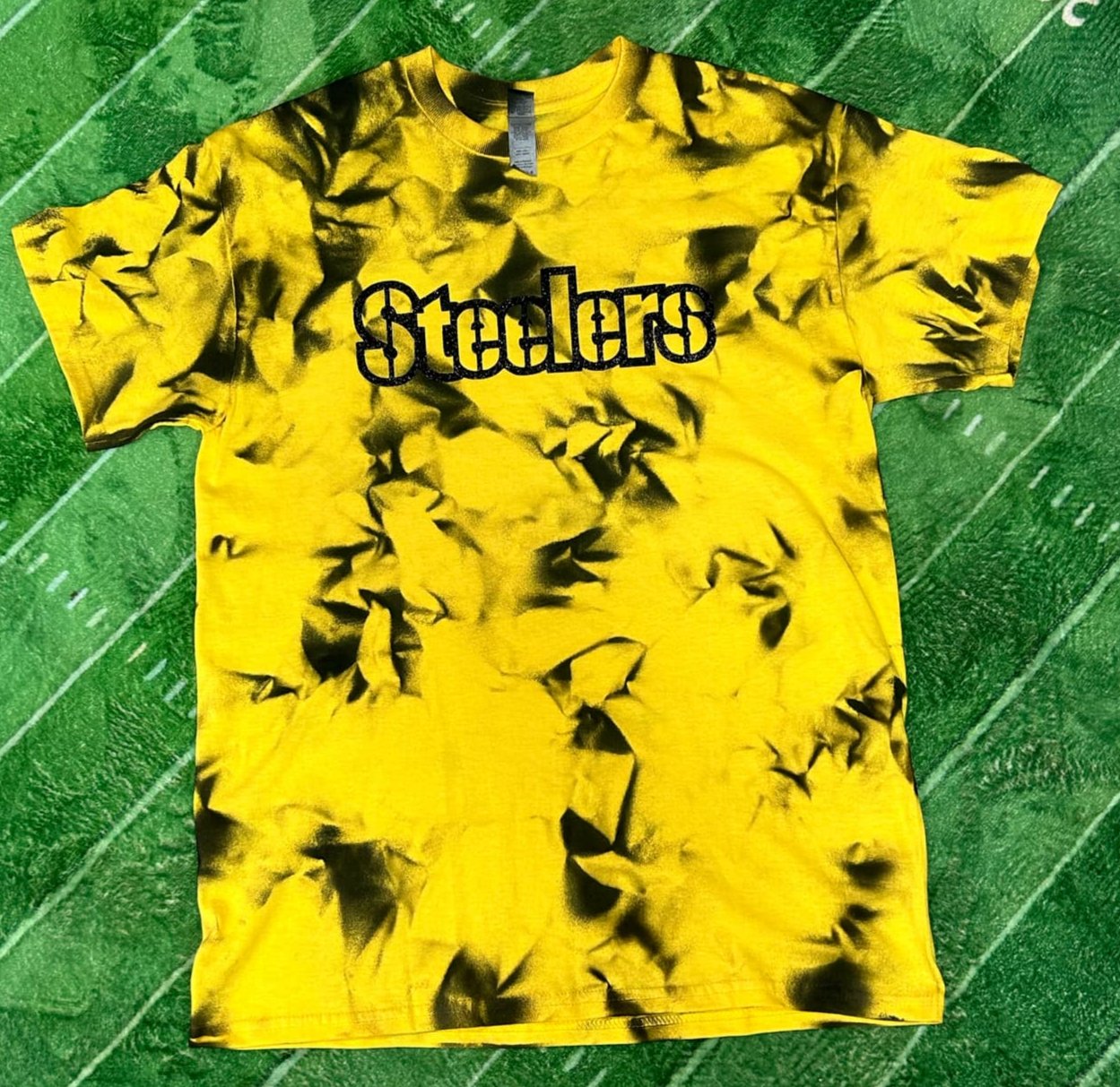 Steelers Black Yellow Dyed Glitter Letter Tshirt. Yellow & Black dyed tshirt with black glitter lettering on front.- Little Gift Nook