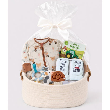 Baby farm theme gift bundle in a basket with cellophane and bow. Little Gift Nook