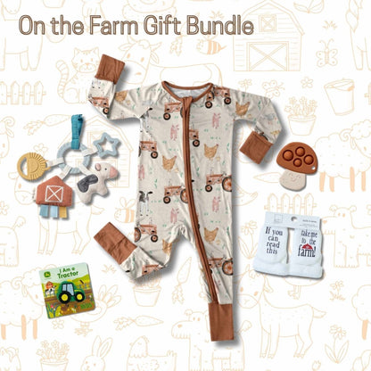 Baby farm theme gift bundle, sleeper, teether, John Deere book, socks, cow toy teether ring on a farm theme background Little Gift Nook 