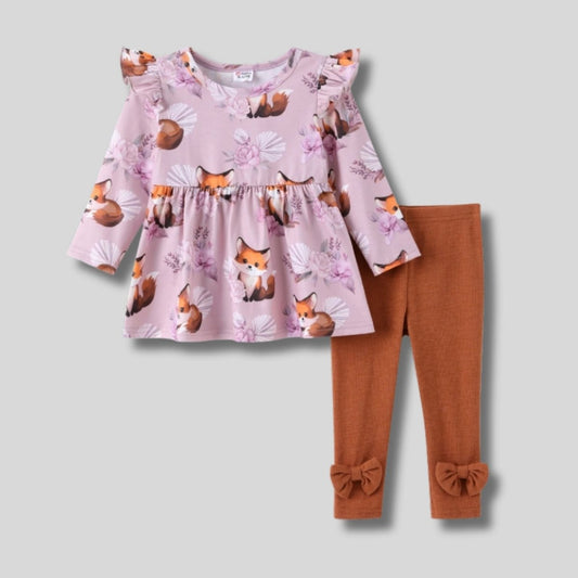 Lavender and orange fox print ruffle top and bow leggings set for baby girl on a light gray background. Little Gift Nook