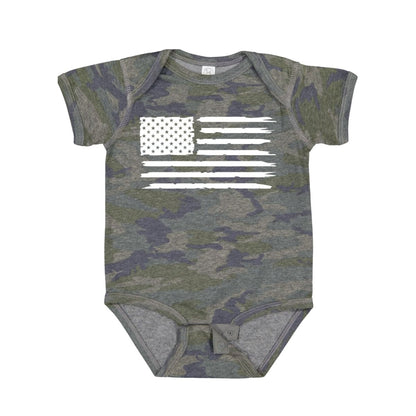 Green and navy baby camo bodysuit with white american flag on front laying on white background.