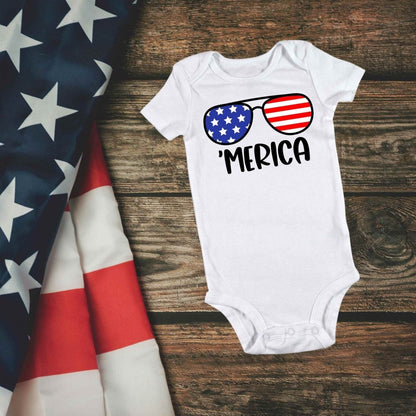 white baby onesie with red blue stars and stripes sunglasses and 'MERICA in black text on front - Little Gift Nook