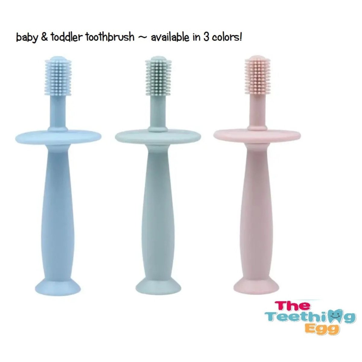 The Teething egg baby tooth brushes in blue green or pink standing on white background with logo.