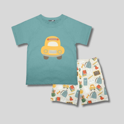 Children's teal t-shirt with a yellow school bus design and matching shorts on a gray background. Little Gift Nook