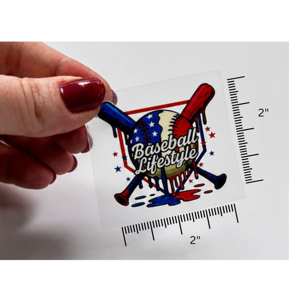 Sticker with 'Baseball Lifestyle' design held by a hand, with measurement guides on a white background.