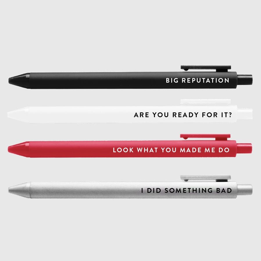 Big Rep Swiftie Pen Set of 4 black ink gel pens black in white, red, black, and silver with lyrics on each sitting on light gray background.  - Little Gift Nook