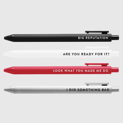 Big Rep Swiftie Pen Set of 4 black ink gel pens black in white, red, black, and silver with lyrics on each sitting on light gray background.  - Little Gift Nook