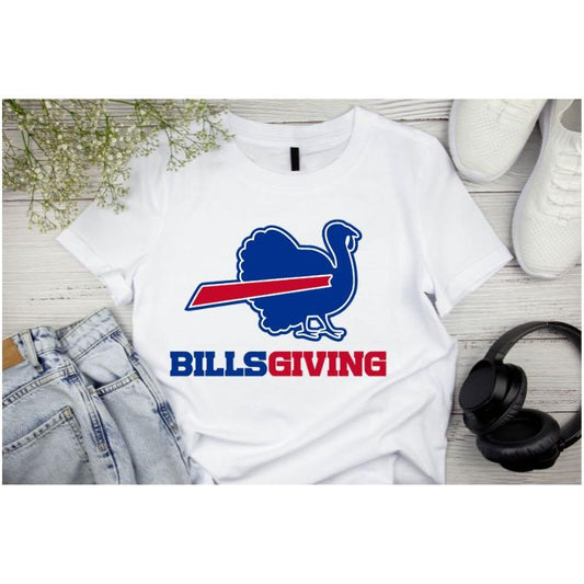 White BILLSGIVING Blue red turkey Buffalo football Thanksgiving tshirt laying on light wood background with jeans, shoes, and headphones. Little Gift Nook 