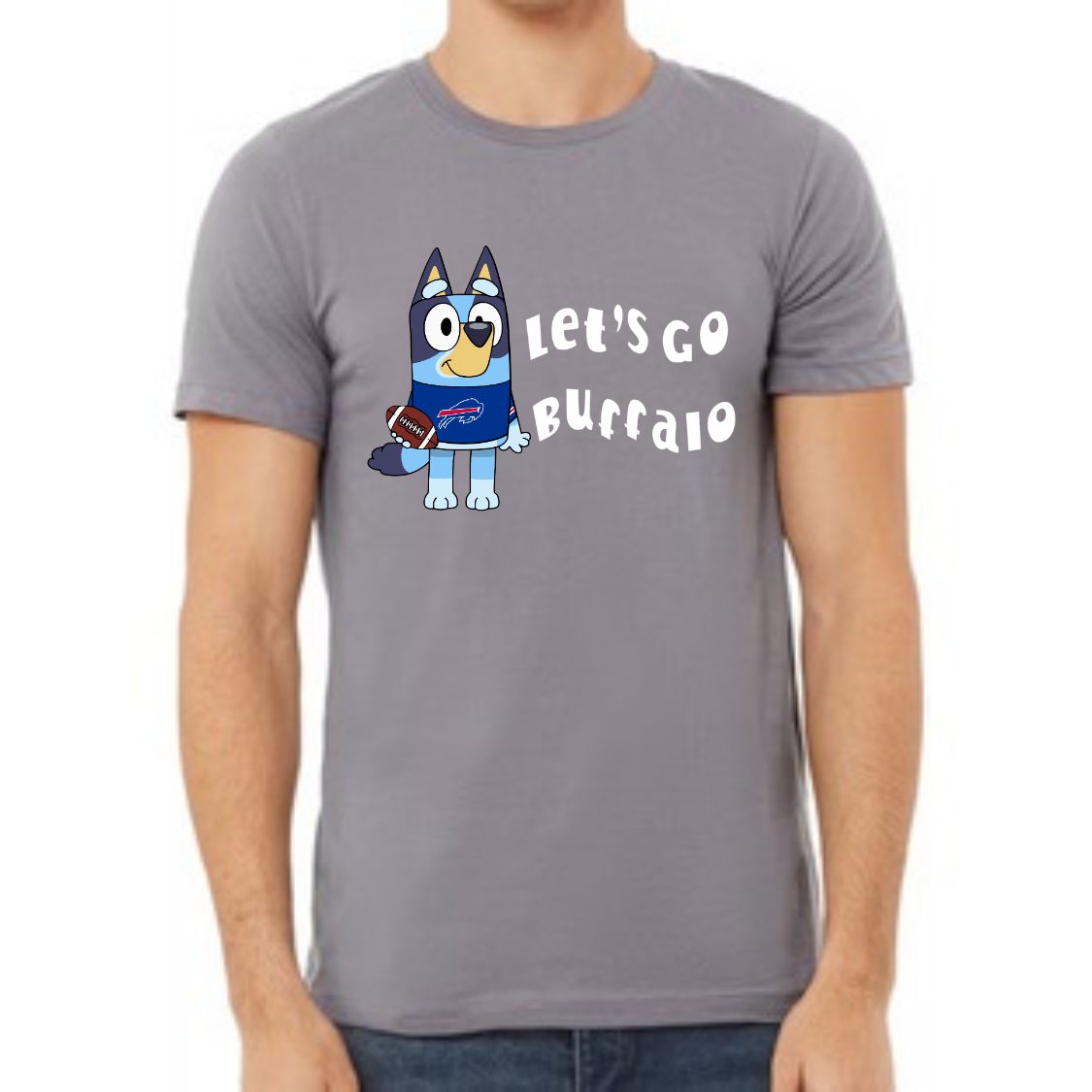 Man wearing storm gray tshirt with blue dog in Buffalo football jersey on front and white text "Let's Go Buffalo" standing on white background.
