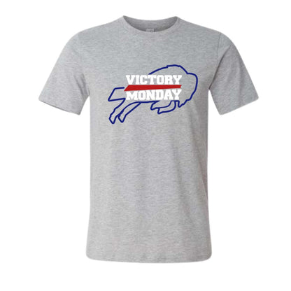 A heather gray short-sleeve crewneck t-shirt featuring a 'VICTORY MONDAY' buffalo graphic on the chest in blue, white, and red.