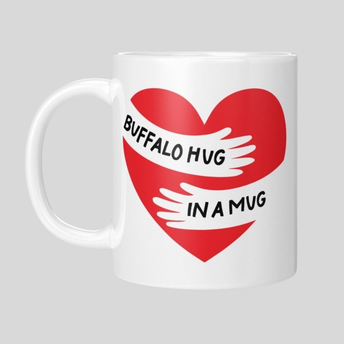 Buffalo Hug in a Mug 11 oz white ceramic coffee mug with red heart and hugging arms design.