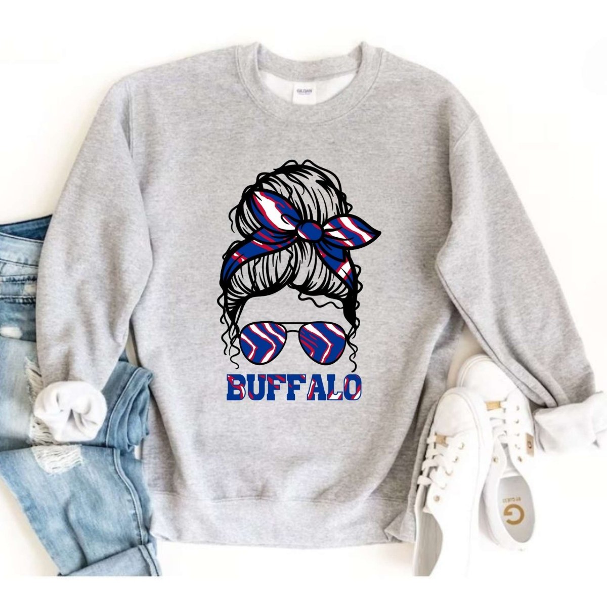 Gray crewneck sweatshirt with buffalo red white blue messy bun sunglasses image on front. 