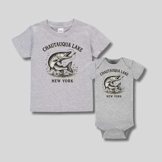 Heather gray Chautauqua Lake Muskie fish New York tshirt and onesie sitting on gray background.