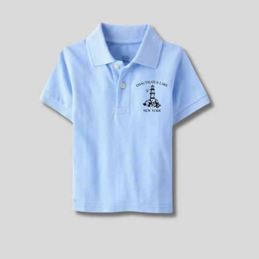 Chautauqua Lake Boys Blue Polo Shirt with black font and lighthouse on left chest. Shirt on gray background. Little Gift Nook