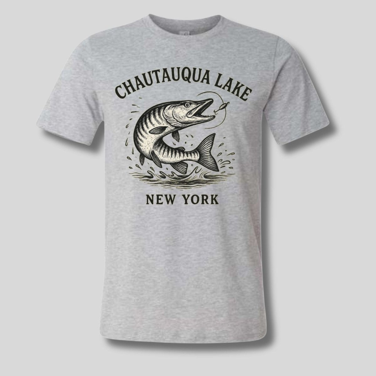 Heather gray "Chautauqua Lake New York" Muskie fish t-shirt on a light gray background - Little Gift Nook.