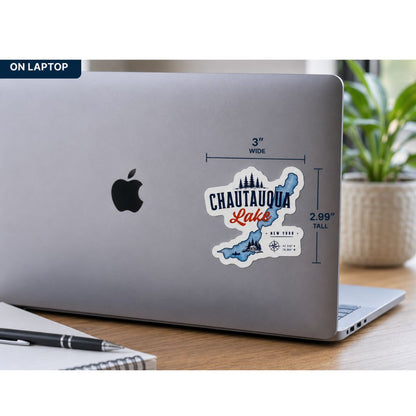 Laptop with a 'Chautauqua Lake' sticker on a desk with a plant in the background
