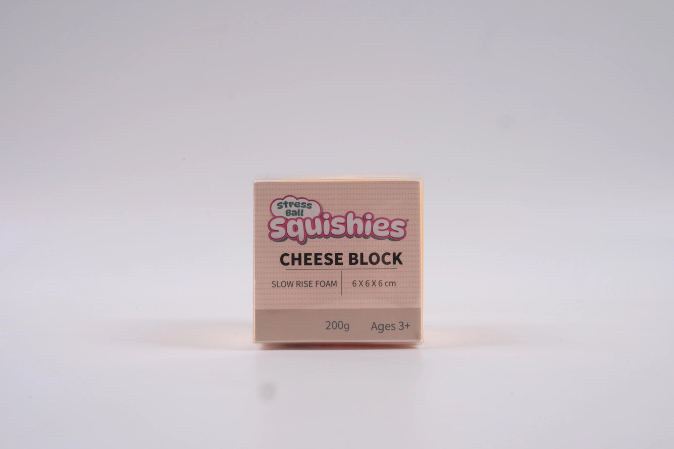 Squishies Cheese block squishy slow rise foam sensory fidget toy in box on a white background.