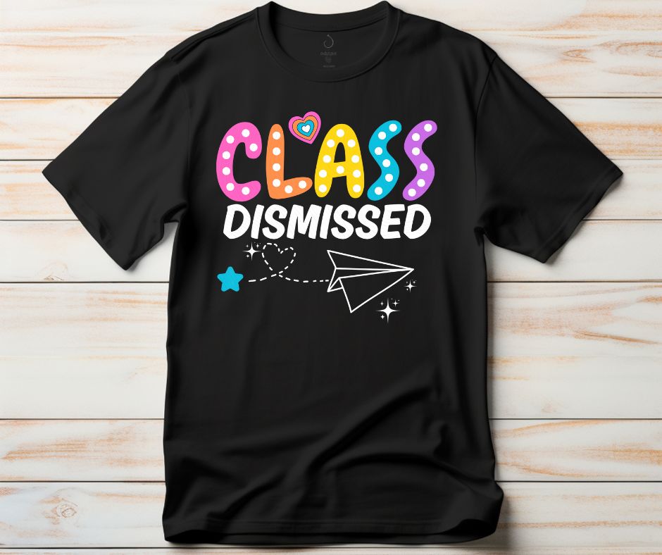 Black Class dismissed paper airplane tshirt on a light wood background. Little Gift Nook