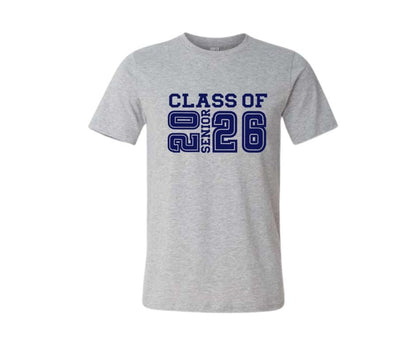 Gray t-shirt with navy Class of 2026 senior text on front sitting on white background. Little Gift Nook