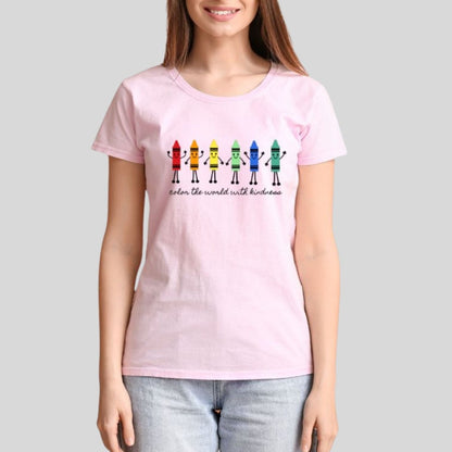 woman wearing a pink tshirt with Color the World with Kindness Crayons Teacher graphic on front. Colored crayons with faces and hands and black lettering under them.- Little Gift Nook