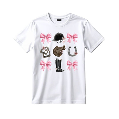White T-shirt featuring pink bows and equestrian graphics including helmet, saddle, boots, stirrups, and horseshoe.