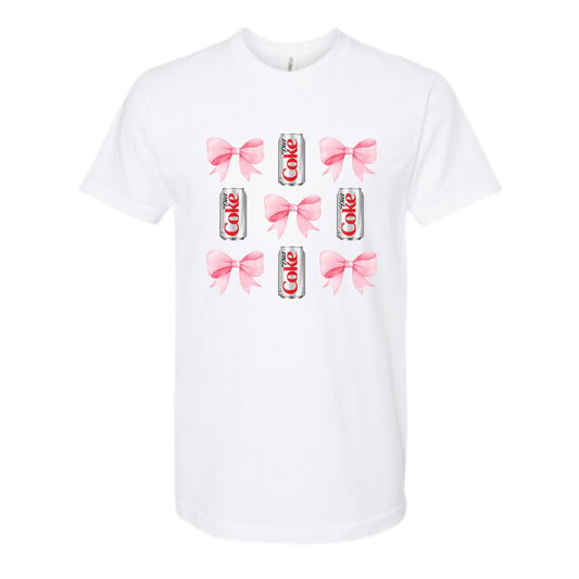 White tshirt with pink bows and diet soda cans sitting on white background. Little Gift Nook